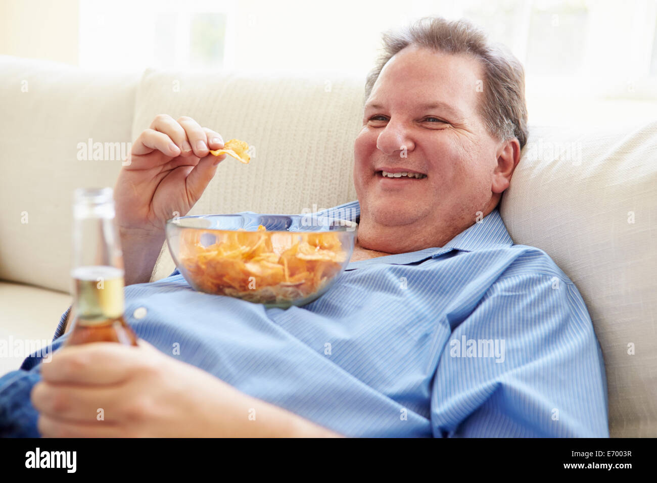 fat guy eating chips.jpg