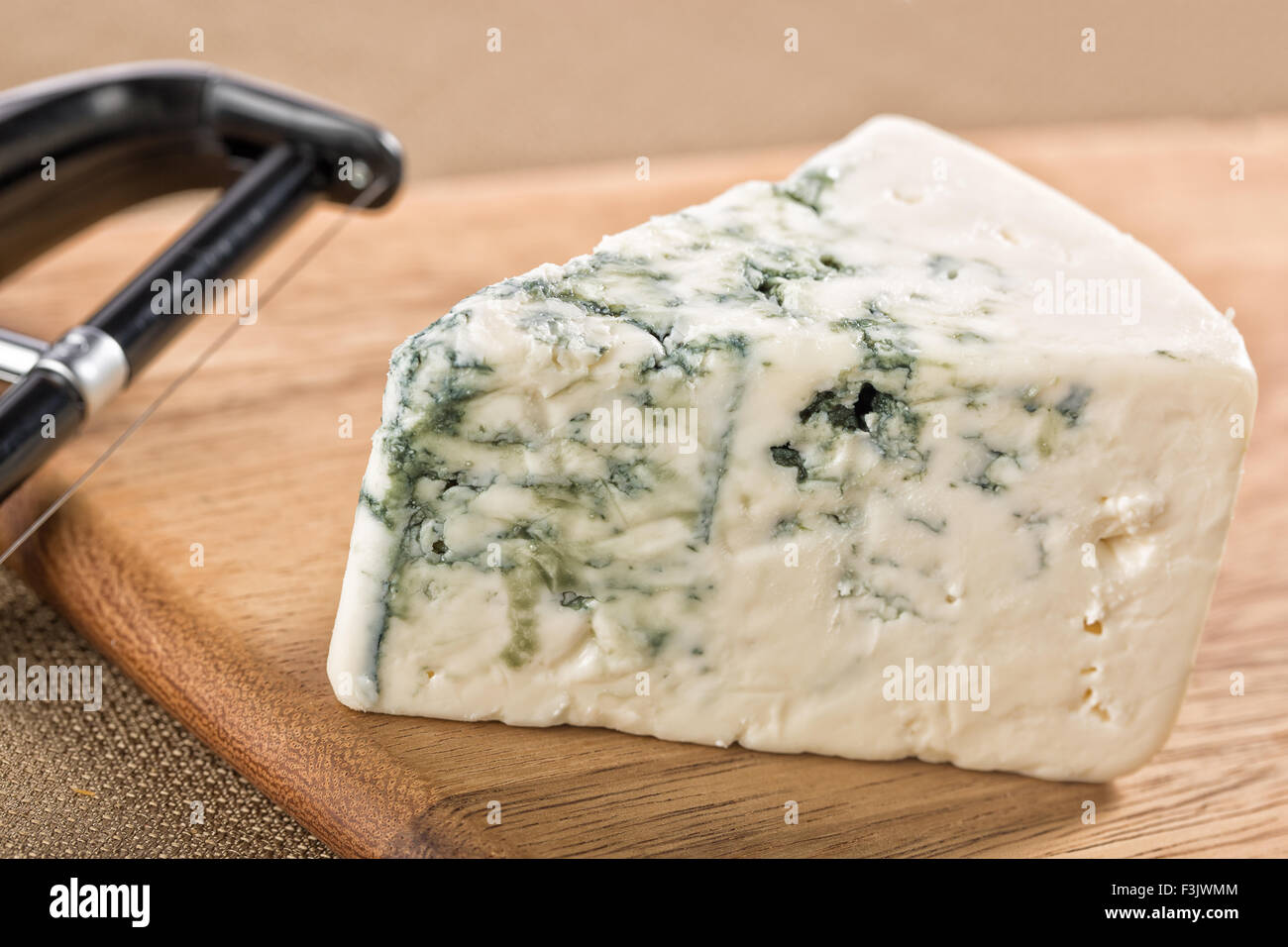 wedge-of-creamy-delicious-gorgonzola-blue-cheese-F3JWMM.jpg