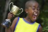 excited_child_with_trophy-300x200.jpg