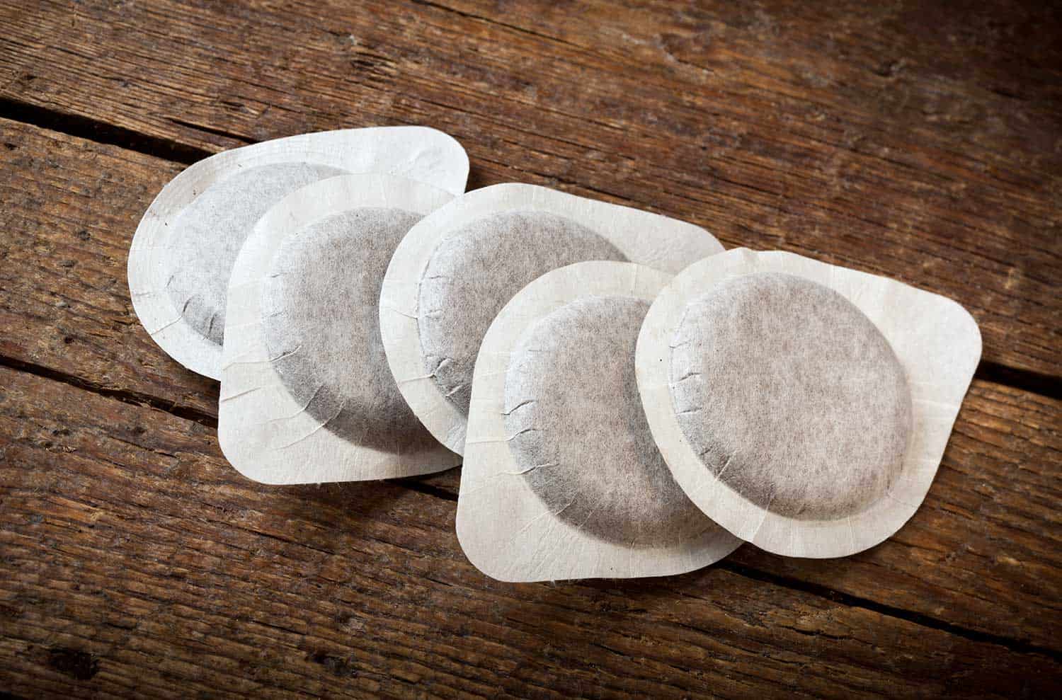 Coffee-pods-on-wooden-table.jpg